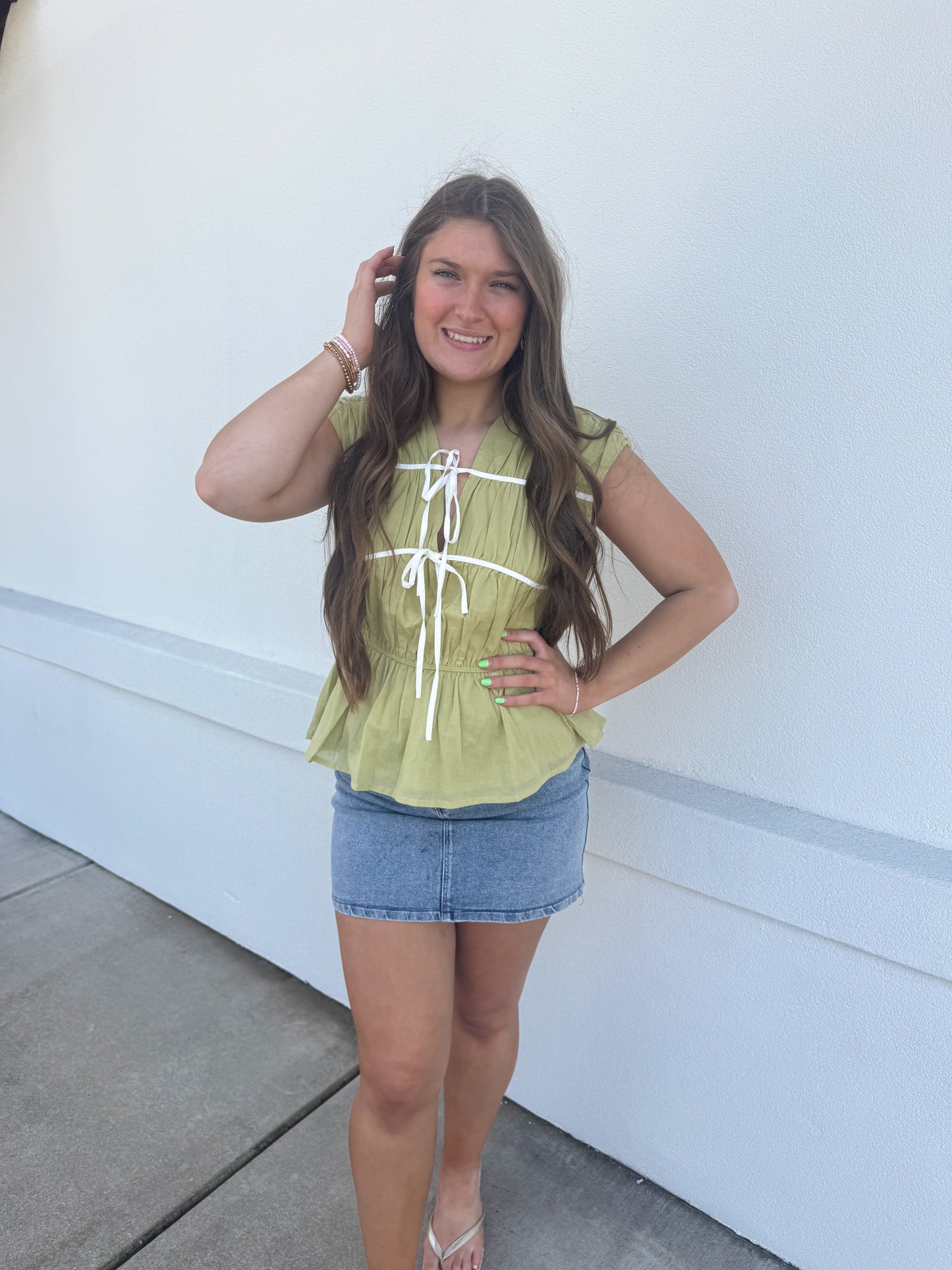 Sleeveless Top with Bow Detail