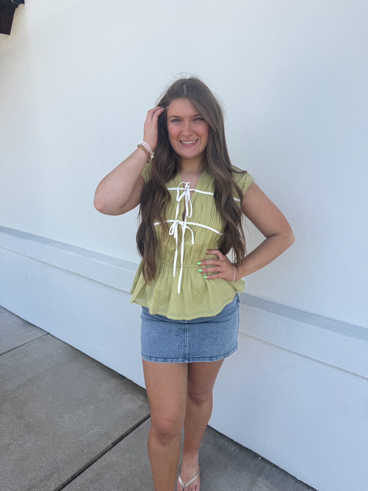 Sleeveless Top with Bow Detail